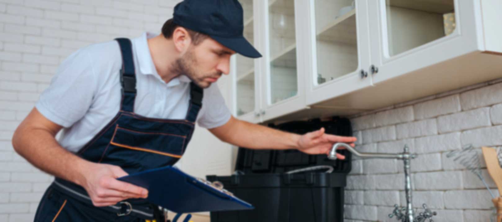 Professional plumber working inside a residential home in Gauteng
